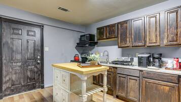 Fridge, microwave, stovetop, coffee/tea maker