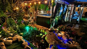 A garden with a pond, rocks, and plants. - THE KOI PONDS RETREAT 3k Sqft OUTDOORS + Kitchen, 2Bd 1 Ba Mstr Suite & Casita (Fullerton)