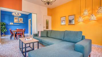 Apartment, 2 Bedrooms, Balcony, City View | Living room | 42-inch Smart TV with cable channels