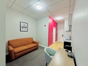 Suite Deluxe, 1 cama Queen size, para no fumadores | Área de sala de estar