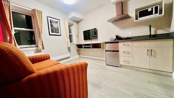 Suite Deluxe, 1 grand lit, non-fumeur | Coin séjour