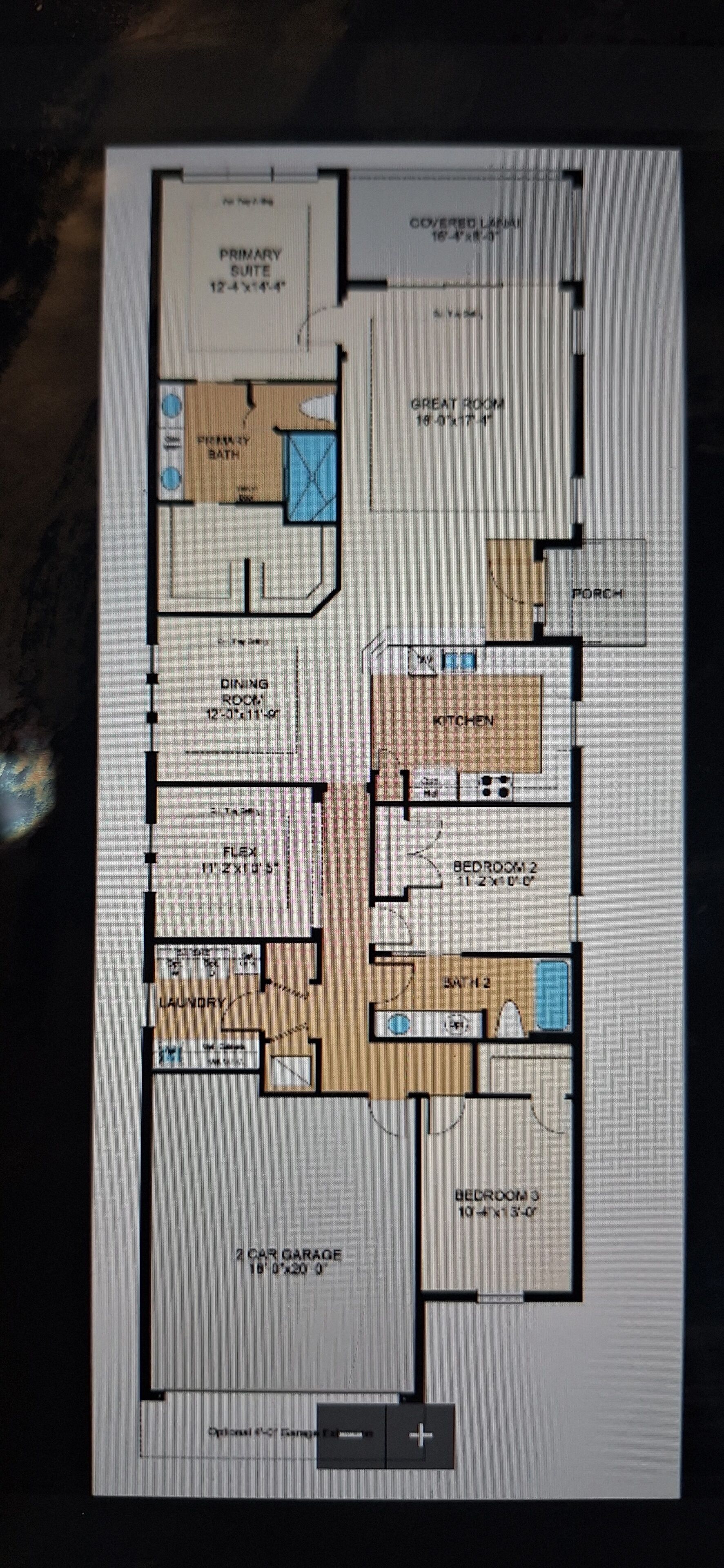 A floor plan of a hotel with a covered lanai, primary suite, dining room, kitchen, two bedrooms, two bathrooms, a laundry area, and a two-car garage.