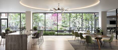 A modern dining area with a bar, large windows, and a chandelier.
