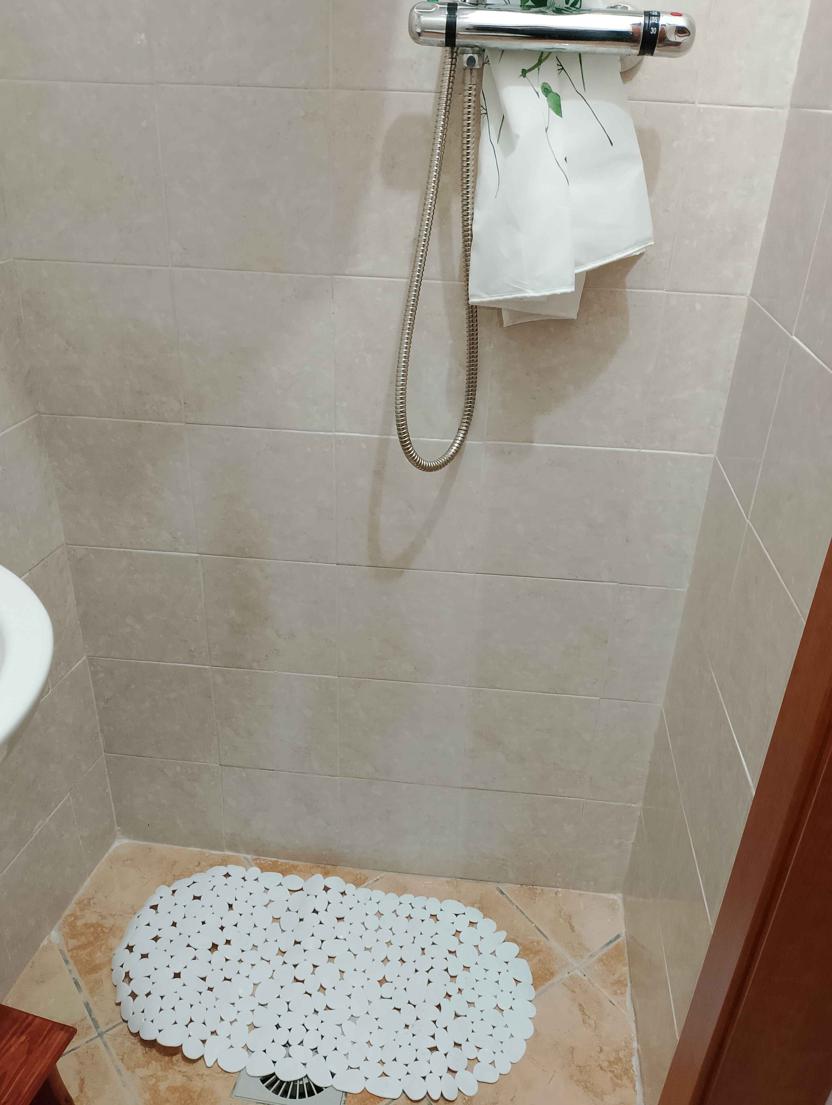 Shower, hair dryer, towels, toilet paper