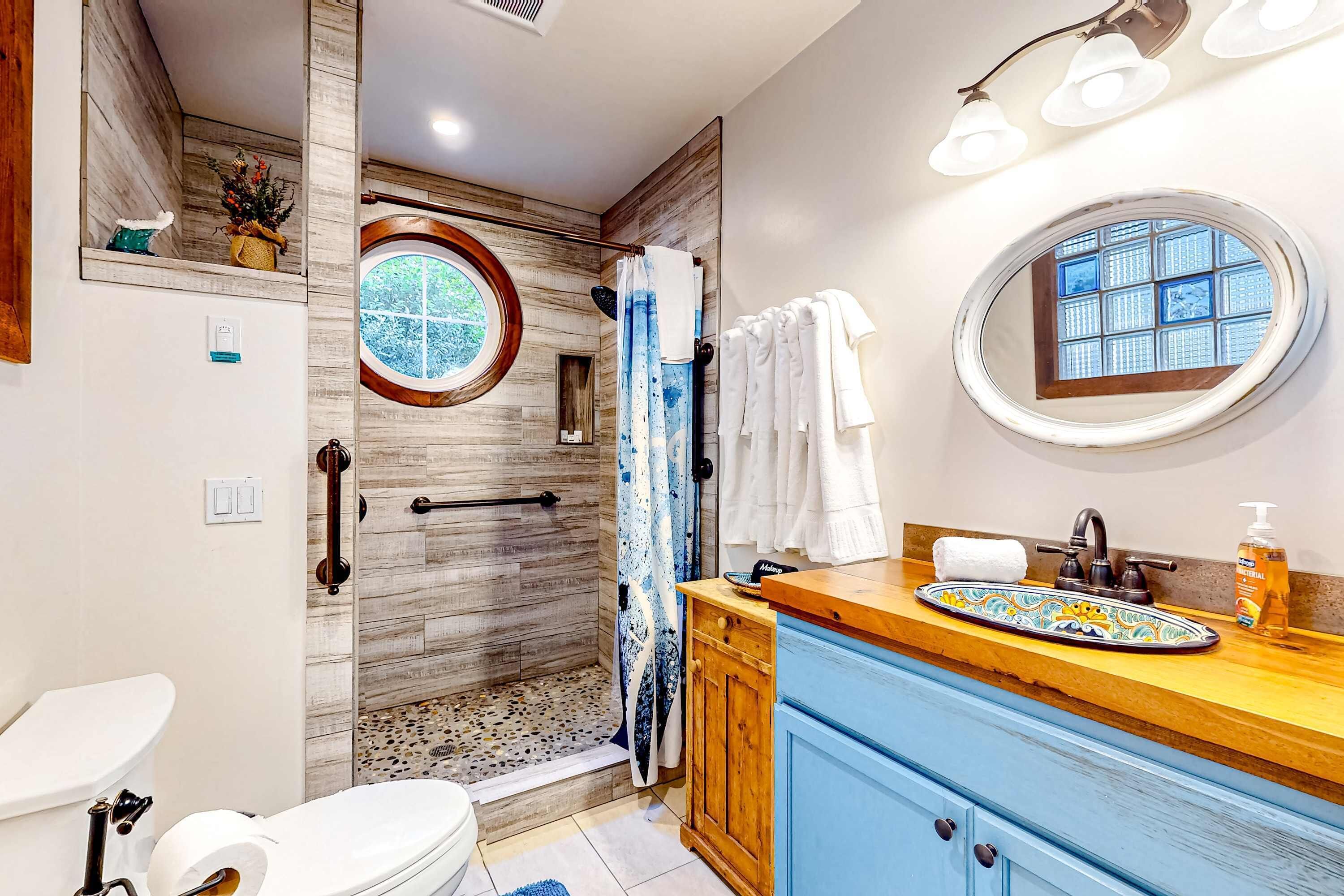 Shower, hair dryer, towels, shampoo