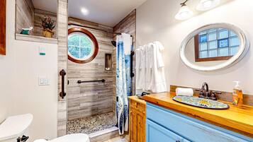 Shower, hair dryer, towels, shampoo