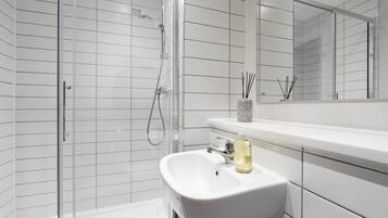 Shower, hair dryer, towels, soap