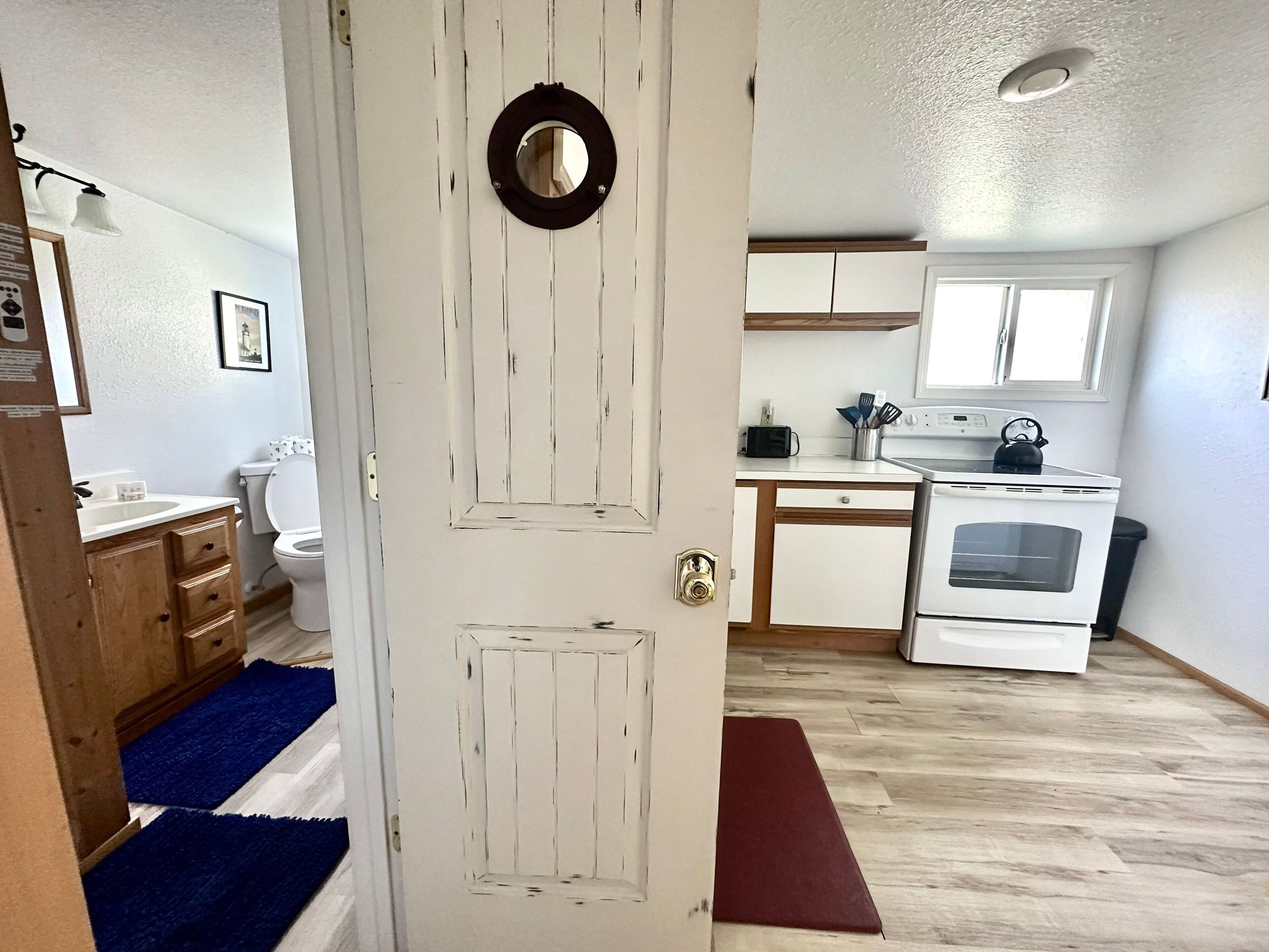 A compact kitchen with a stove, oven, and countertop.