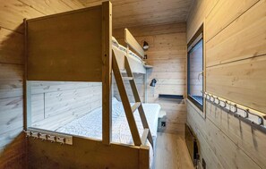 A compact, wooden cabin room with bunk beds, a small window, and a ladder. - Amazing apartment in øyer with WiFi (Øyer)