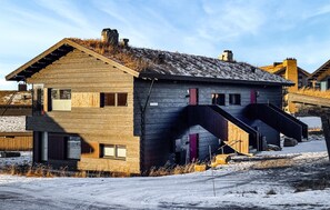 A rustic wooden building with a steep staircase leading to a second level. - Amazing apartment in øyer with WiFi (Øyer)