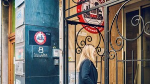 A hotel entrance with a sign indicating it is on the 6th floor and has private suites. - Circel of 2 (Belgrade)