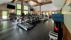 A spacious gym with treadmills, ellipticals, and weight machines. - Greenspring towhhome- Free shuttle and clubhouse (Dover)