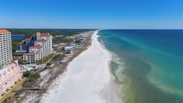 A coastal hotel with multiple buildings, a beach, and a clear view of the ocean. - Stylish Gulf-Front Condo w/ Balcony & Pools (Miramar Beach)