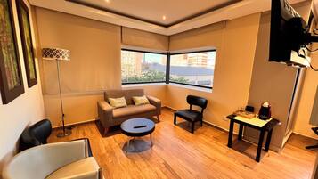 Presidential Double Room, City View | Living area | 42-inch LCD TV with cable channels