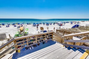 A beach view with a wooden deck and a shoe rack. - Gulf-front condo: 2BR, pools, direct beach (Miramar Beach)