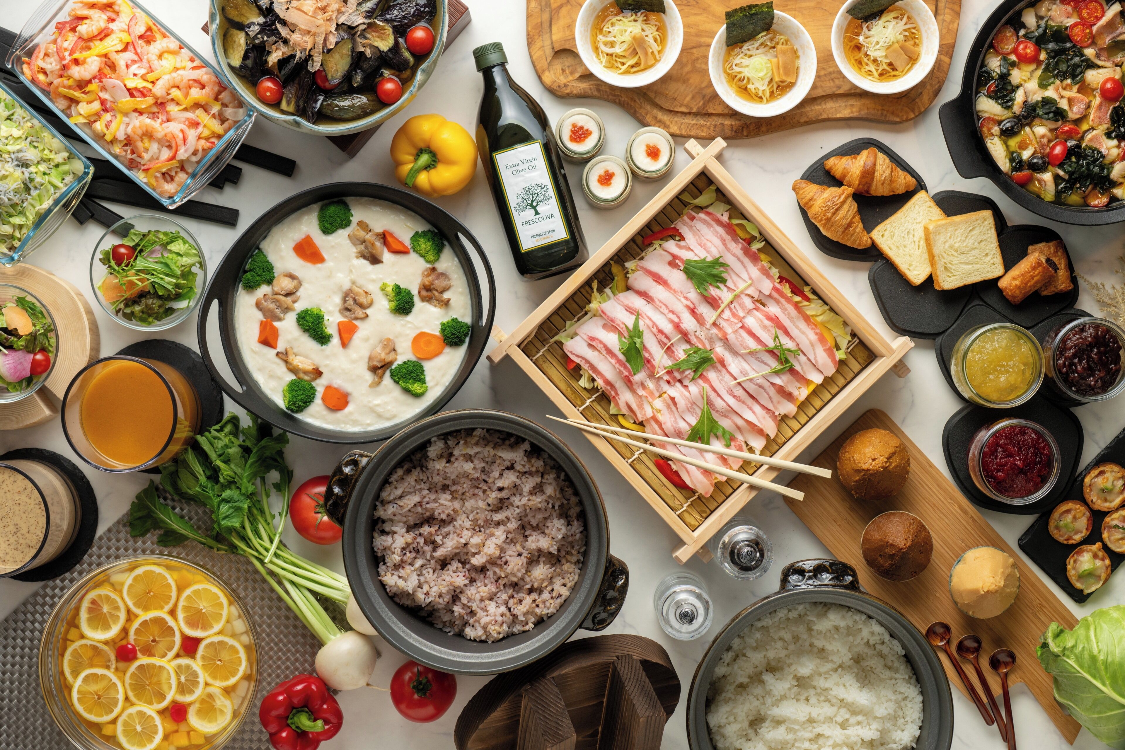 A variety of dishes including rice, soup, and meat, suggesting a diverse meal selection.