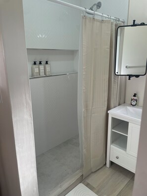 Shower, towels, soap, toilet paper