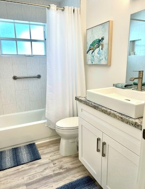 Shower, hair dryer, towels, soap