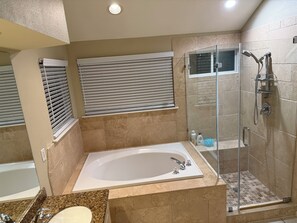 Jetted tub, hair dryer, towels, soap