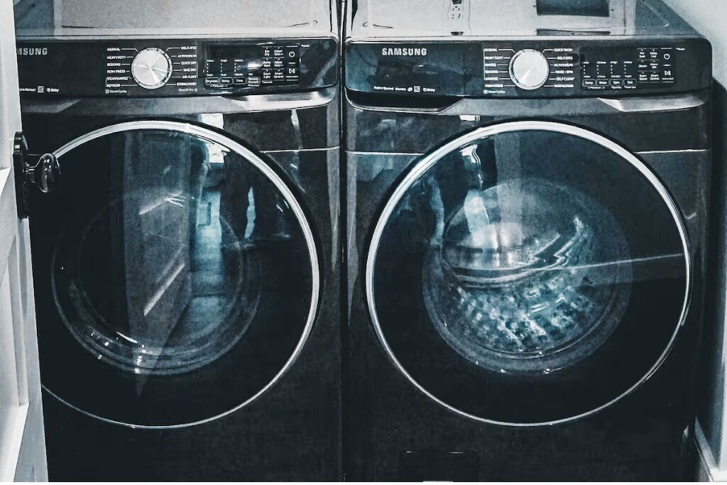 Two Samsung front-loading washing machines side by side.