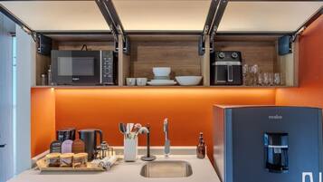 Fridge, microwave, coffee/tea maker, cookware/dishes/utensils