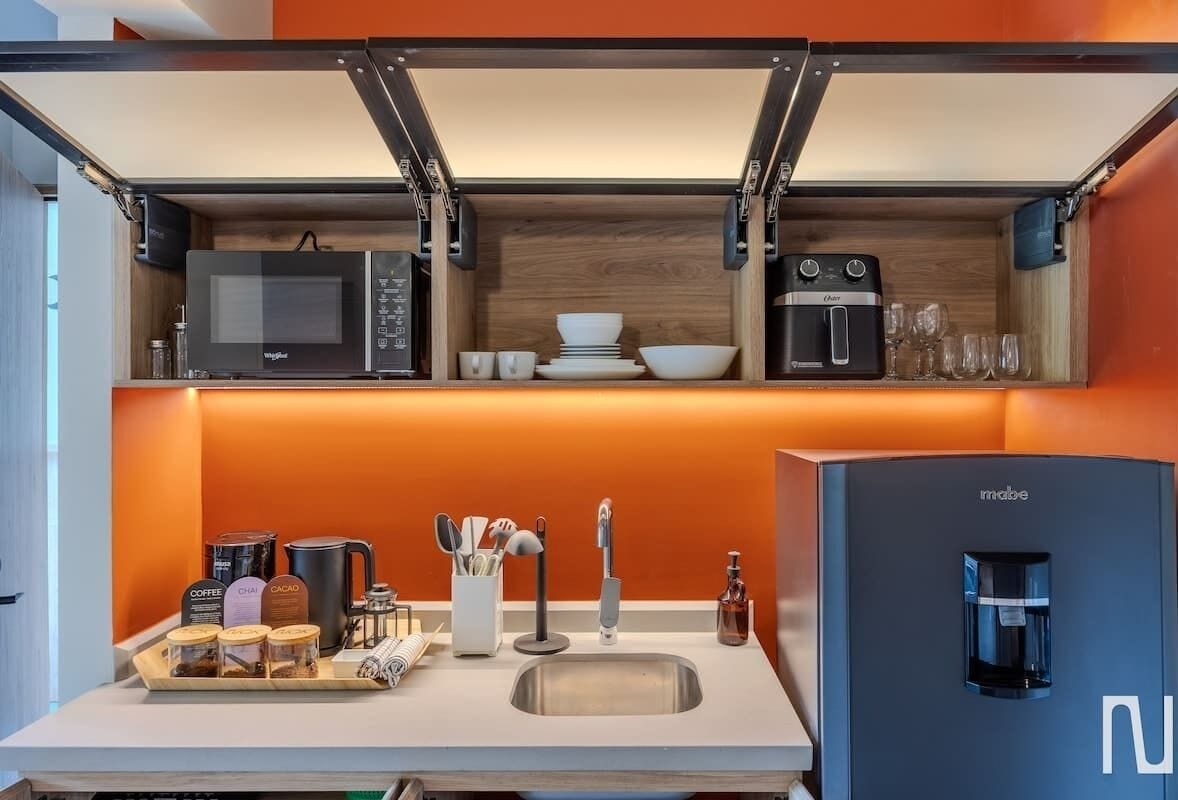 Fridge, microwave, coffee/tea maker, cookware/dishes/utensils