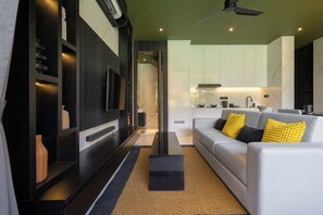 Deluxe Villa, 1 Bedroom, Balcony, Pool View | Living area | 32-inch Smart TV with digital channels