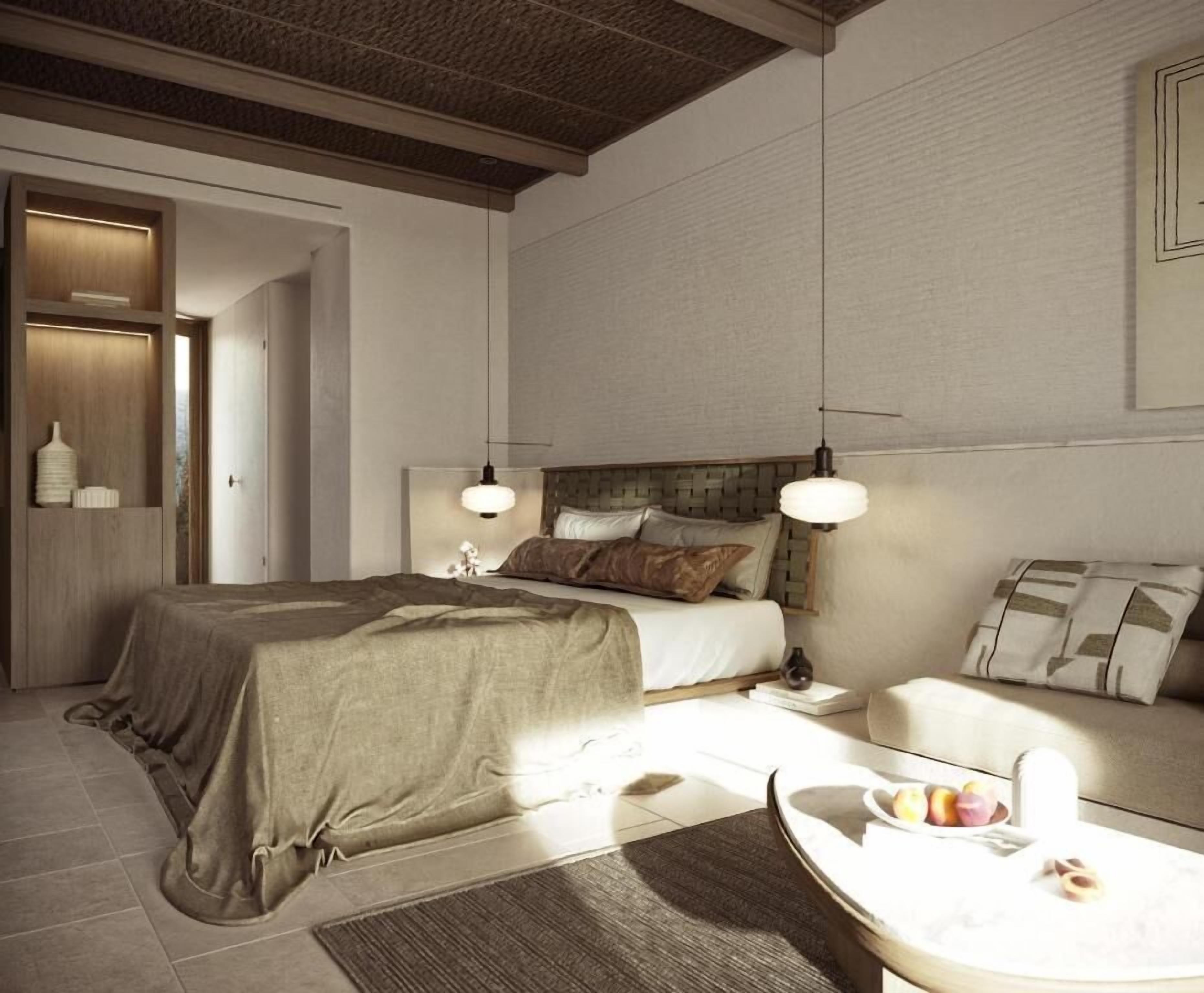 Una camera da letto moderna con un letto grande, comodini, un divano e un tavolo da pranzo con frutta.