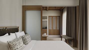 A modern hotel room with a large bed, a wooden headboard, a desk, and a wardrobe.
