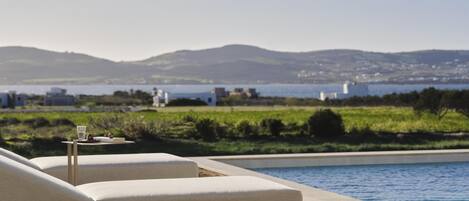 Seasonal outdoor pool, pool umbrellas, sun loungers