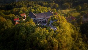 An aerial view of a historic building surrounded by dense forest. - Lukec Homestead Adventure Studio Meta, Kostel, Slovenia (Kostel)