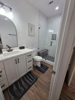 Shower, hair dryer, towels, soap