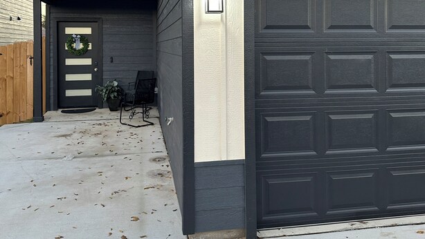 A two-story house with a garage numbered 101.