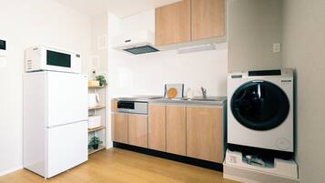 Family Condo, City View | Private kitchen | Full-size fridge, microwave, stovetop, electric kettle