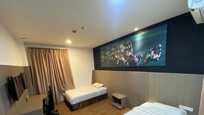 A hotel room with two beds, a TV mounted on the wall, a desk, and a chair. - Arafah Hotel Nilai (Nilai)