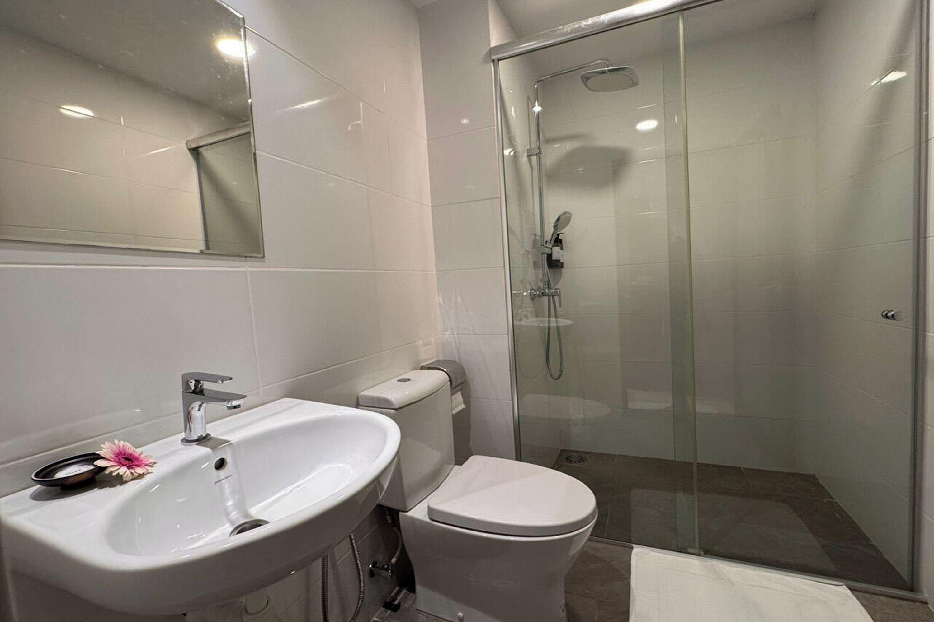 Shower, rainfall showerhead, hair dryer, towels