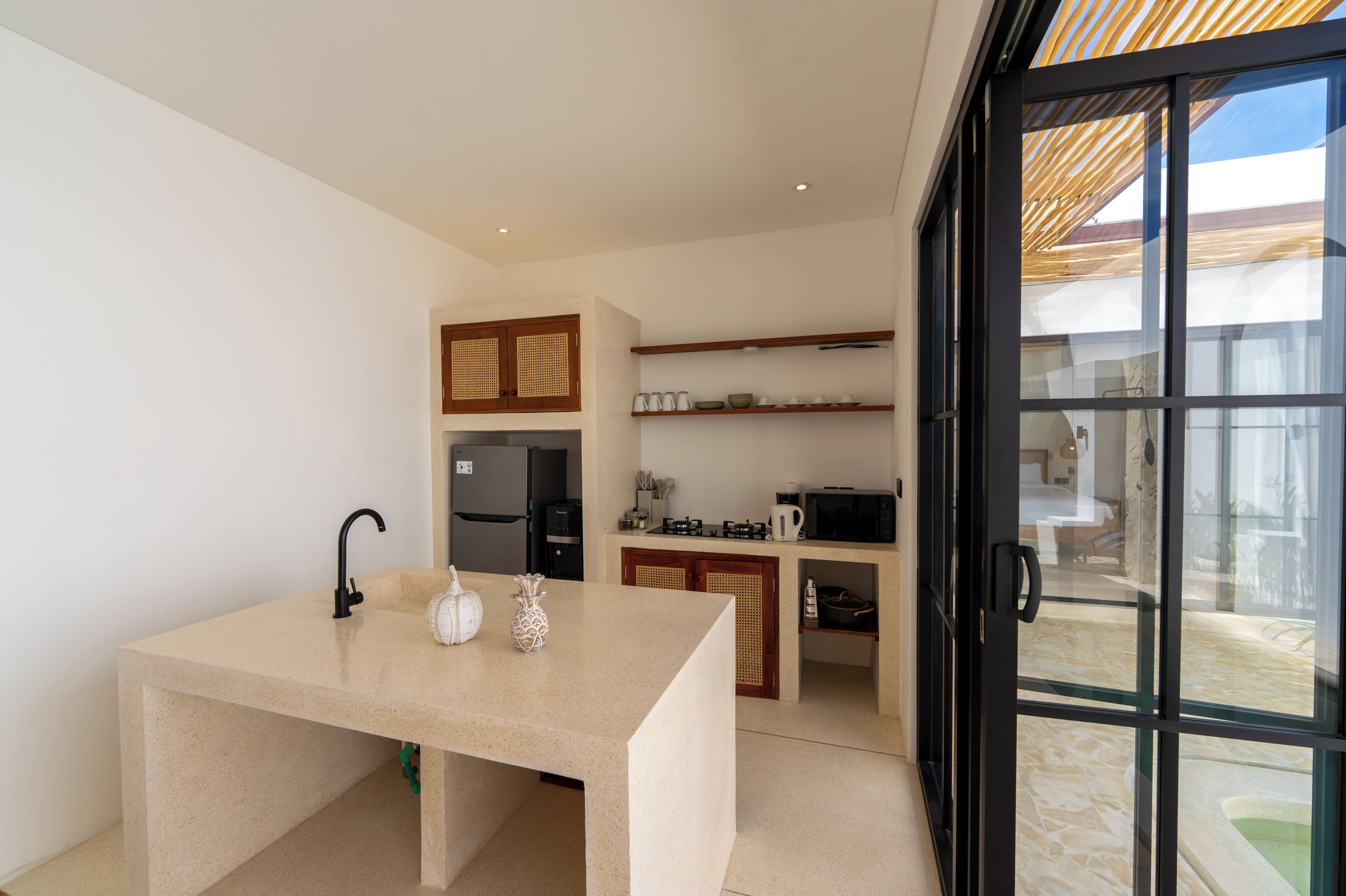 A modern kitchen with a countertop, sink, and cabinets.