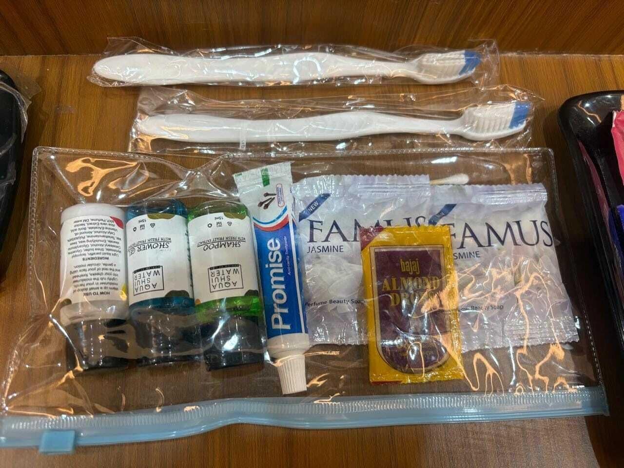 A bathroom with a toothbrush, toothpaste, and a bar of soap.
