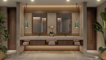 A modern bathroom with a wooden vanity, two mirrors, and green pendant lights.
