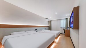 A hotel room with two beds, a desk, a chair, a TV, and a window with curtains. - Anyi (Beijing)