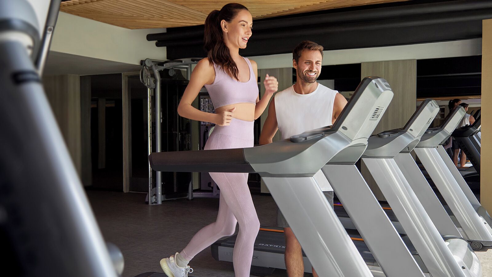 A gym with treadmills and exercise equipment.