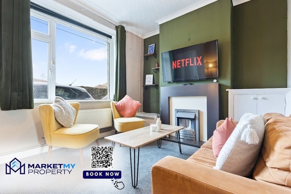 Relax in the stylish living area featuring cozy seating and a welcoming atmosphere.