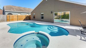 A backyard with a swimming pool, a hot tub, and a wooden fence. - Apopka Family Home w/ Yard, 13 Mi to Dtwn Orlando (Apopka)