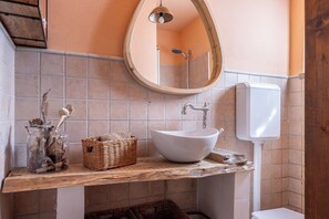A bathroom with a white sink, a wooden vanity, a mirror, and a toilet. - Wonderful private villa for 8 people with private pool, WIFI, A/C, TV and veranda (Lari)