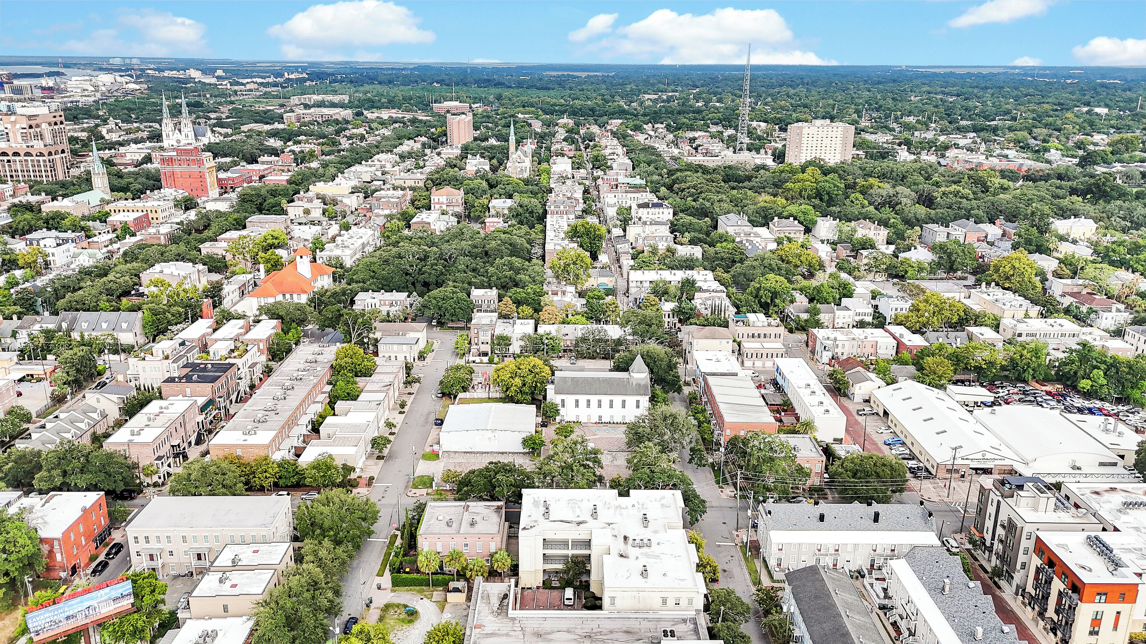 An aerial view of a city with dense urban development, including various buildings and streets.