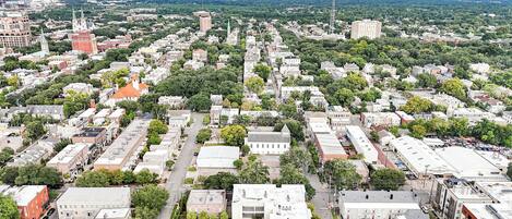 An aerial view of a city with dense urban development, including various buildings and streets.