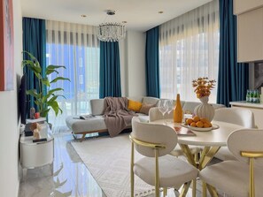 TV - Apartment 1+1 Qoople by the sea on the 1st line of Excellence 49 (Alanya)