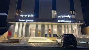 A building with a sign reading "Velmist Residence" and "Serviced Apartments". - Velmist Residence Abha (Abha)