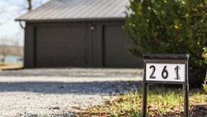 A mailbox with the number 261 in front of a building. - Flat access - covered boat slip with dock-two car garage - year round water (Spring City)