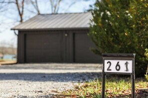 A mailbox with the number 261 in front of a building. - Flat access - covered boat slip with dock-two car garage - year round water (Spring City)